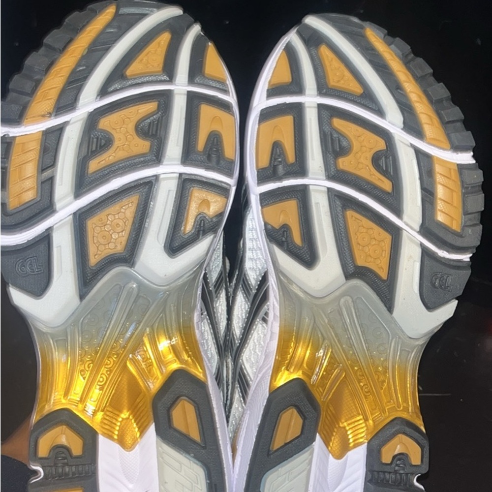 Dynamic Athletic Shoes with Gold and Gray Soles